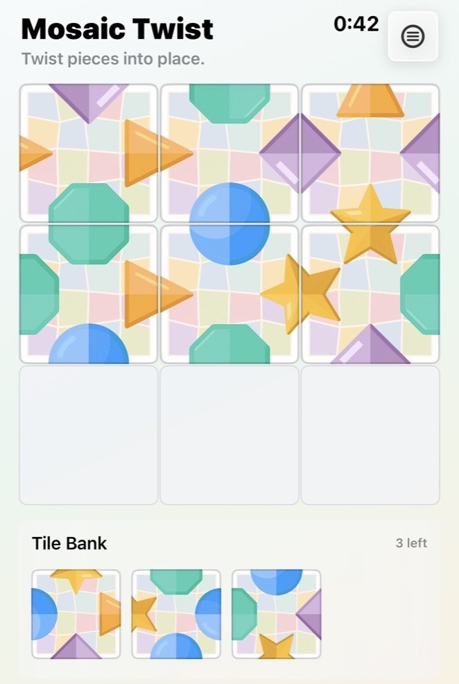 A Standard Mosaic Twist puzzle with colorful shape tiles on a three-by-three board.